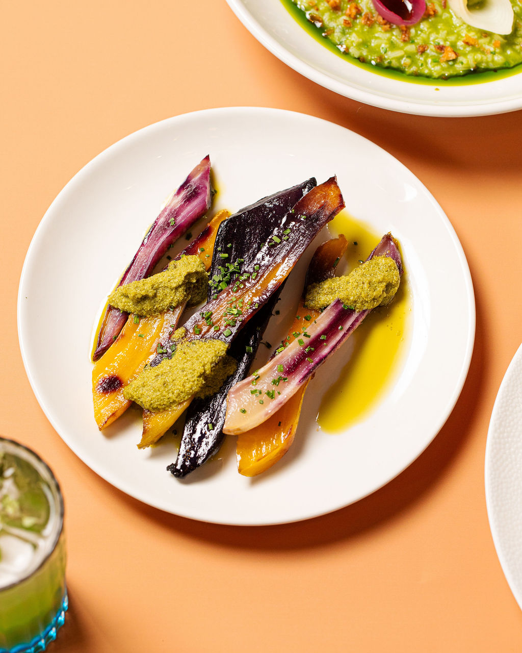 Beef-fat carrots on a gold studio backdrop
