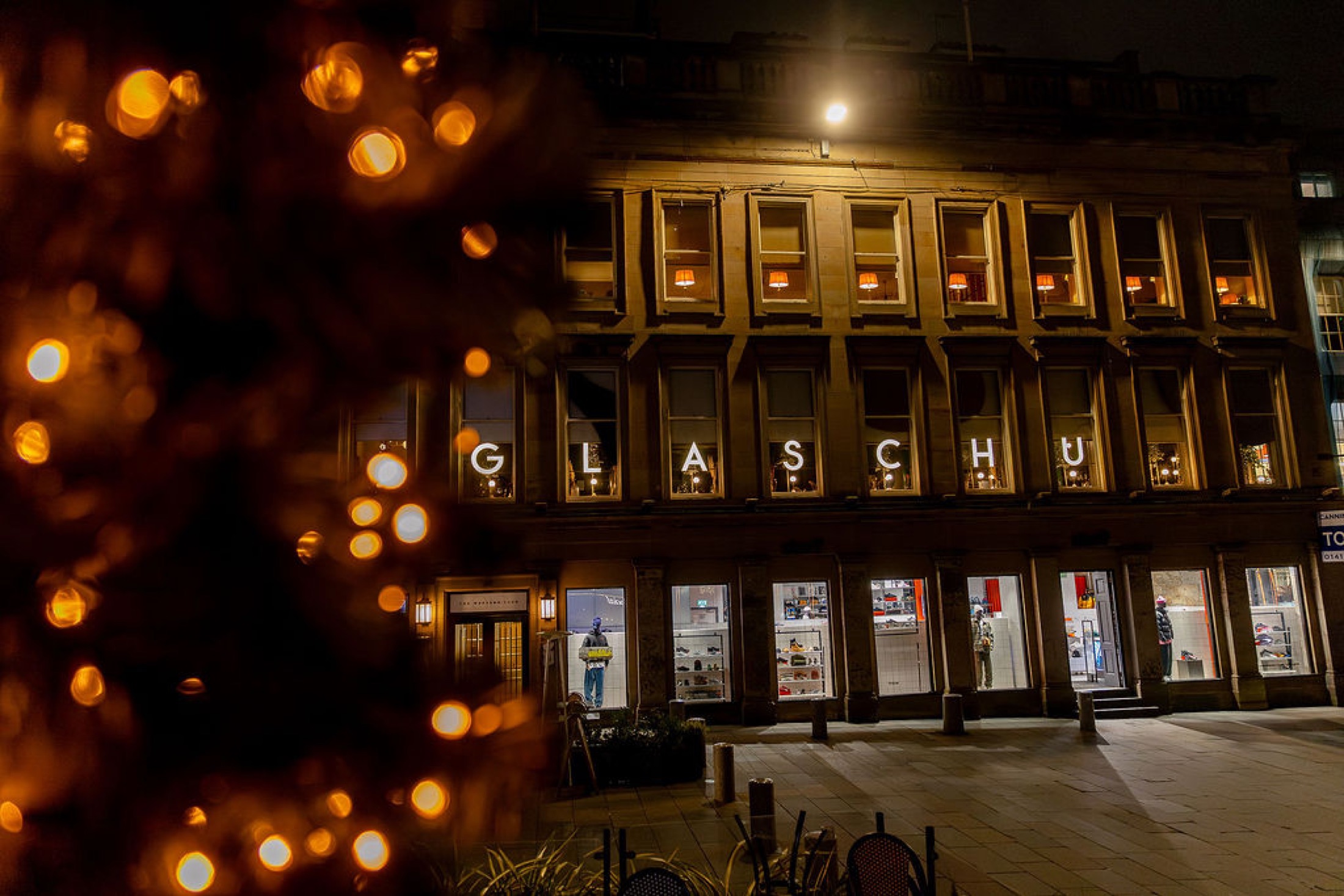 The Glaschu building on Royal Exchange Square lit up at night for Christmas